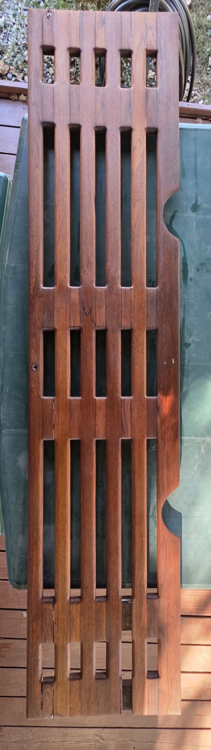 After teak restoration: full slotted panel with a richer finish and visible natural grain
